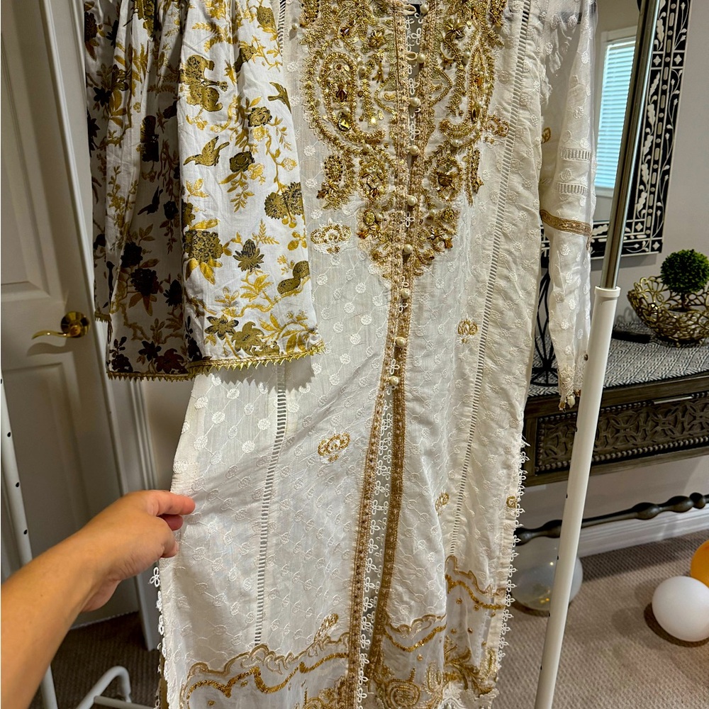 Paper cotton dress with heavy embroidery and embellishments. Gharara pants.